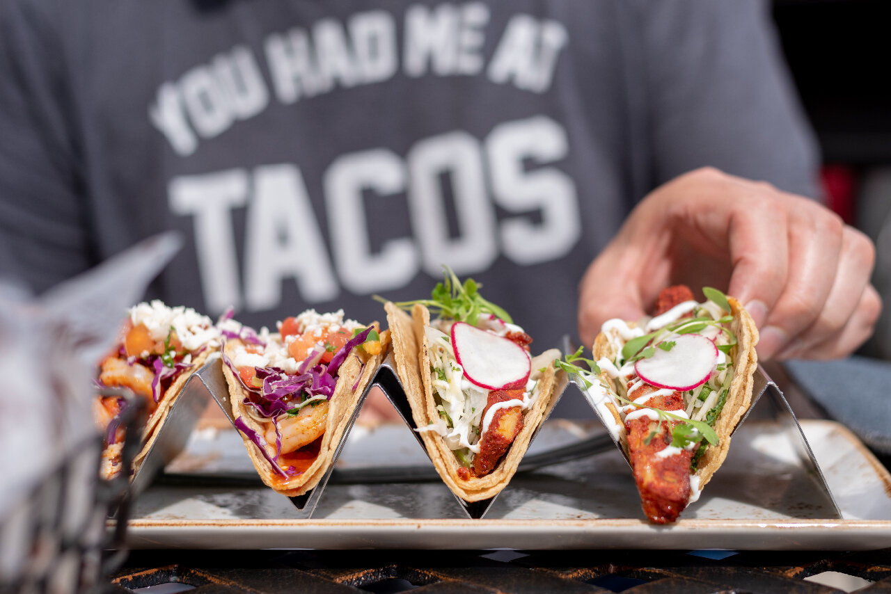 Server with Tacos and a shirt that reads you had me at tacos